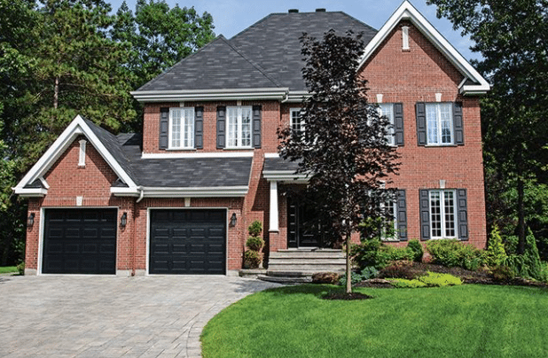 Black Garage Doors on Red Brick House